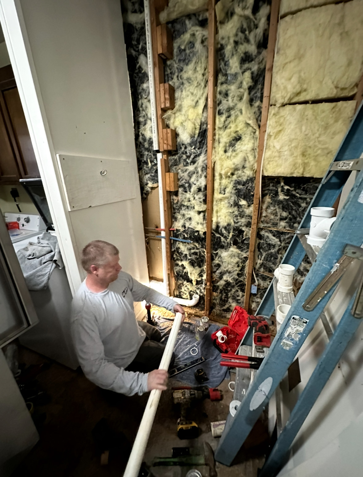 1 A+ Plumber performing plumbing repairs inside a home